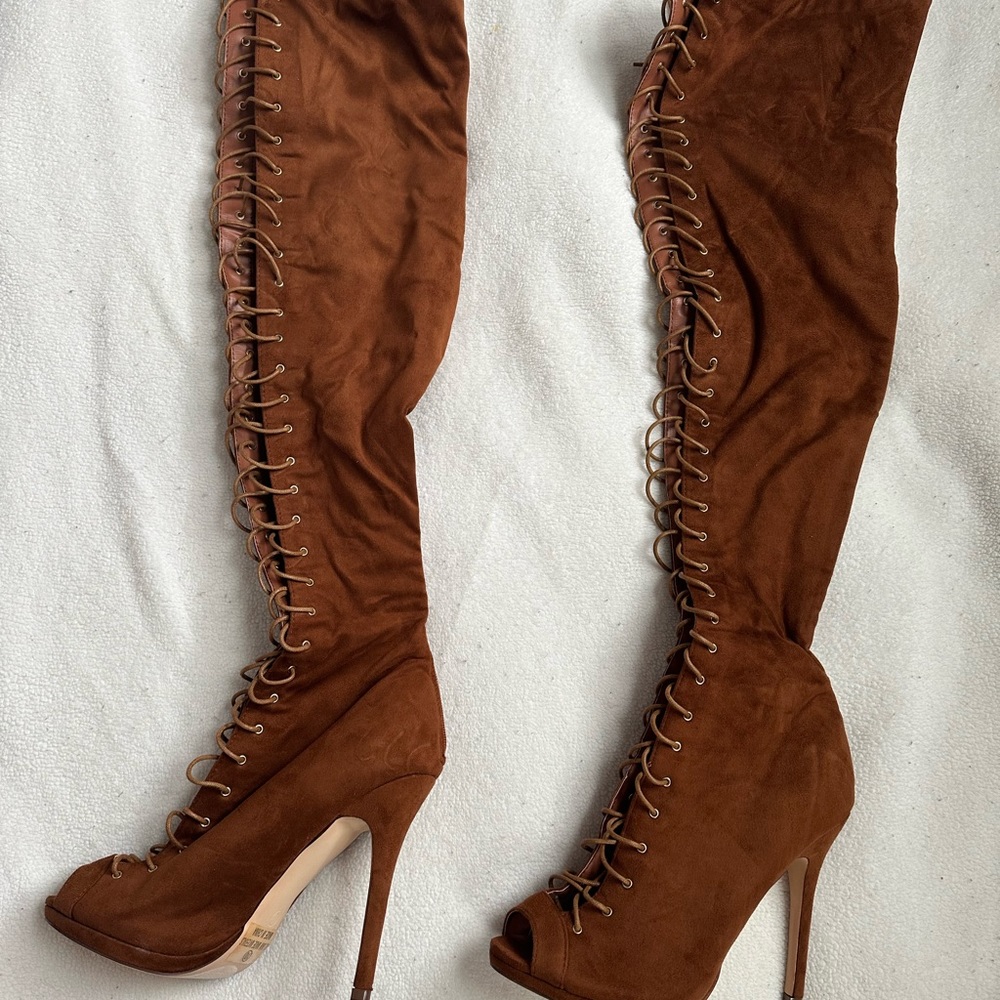 Thigh high suede lace boot.